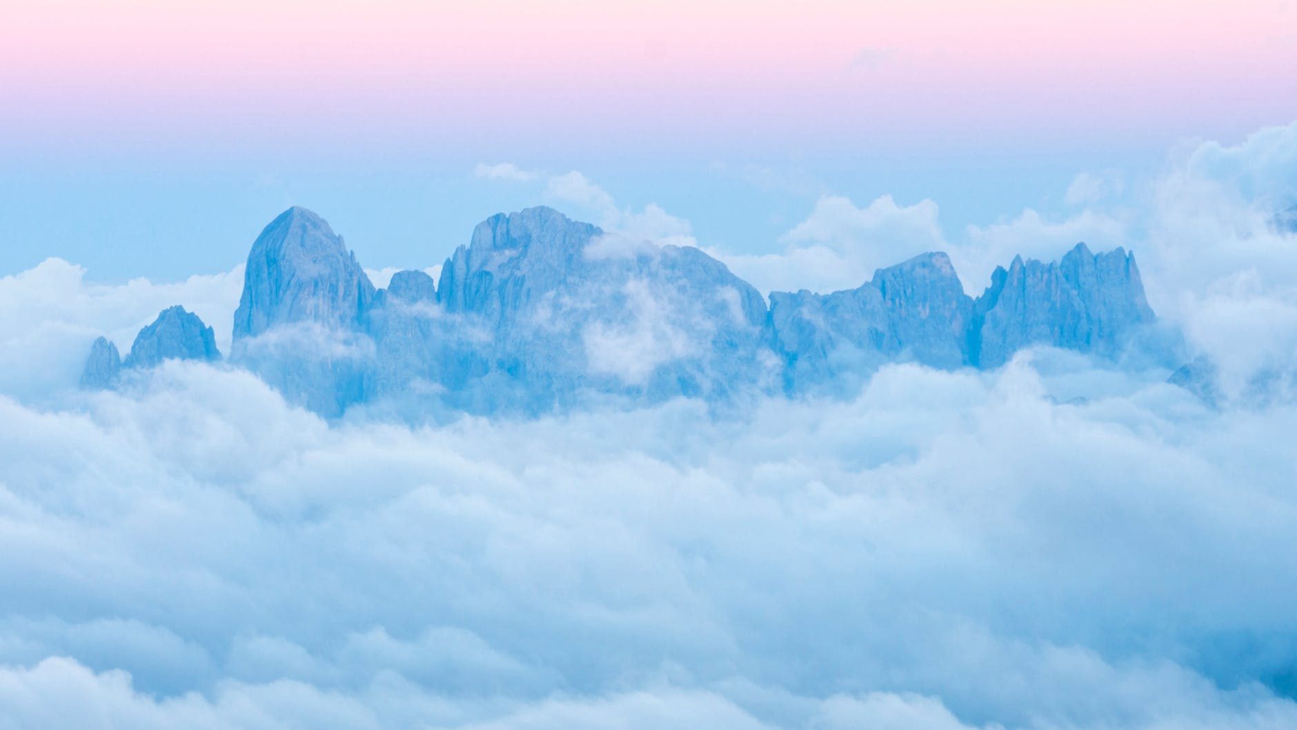 drone shot of foggy mountains during sunset